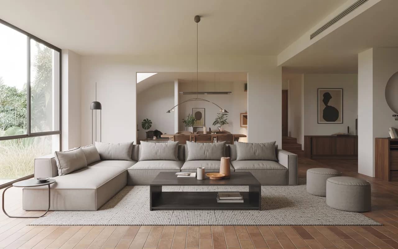 Open-plan contemporary living room with modular sofa, coffee table with storage, area rug defining seating area, and clean, uncluttered layout.